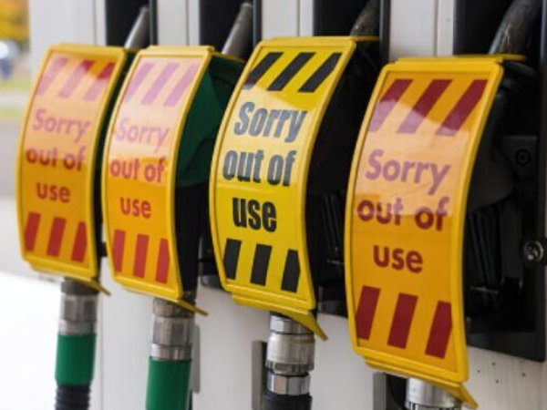 Petrol pumps with signs saying out of fuel