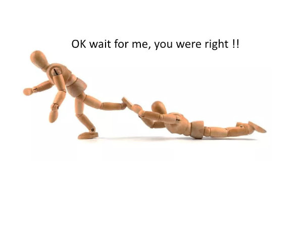 Artist posing dolls with one being dragged by the other doll
