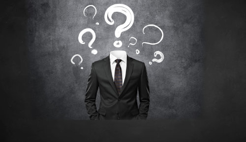 image is black suite with question marks around the tio