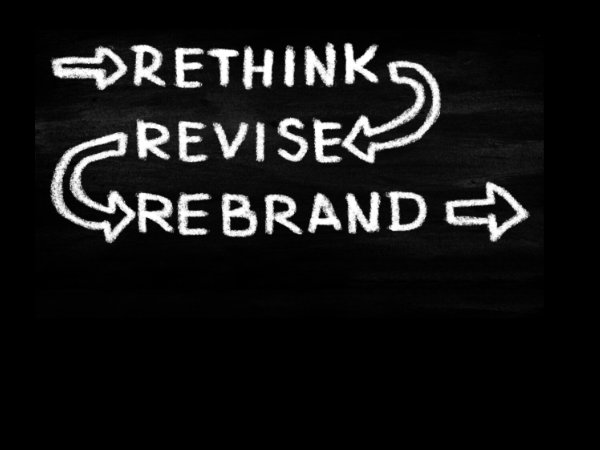 Chalk Board with words Rethink Revise Rebrand